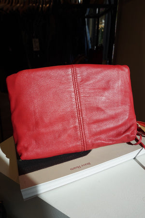 Agent Reclaim Sky on Lipstick Red Leather Clutch
