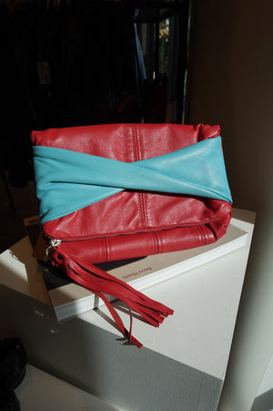 Agent Reclaim Sky on Lipstick Red Leather Clutch